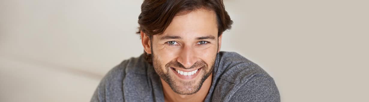 an image of a happy man smiling with white teeth.