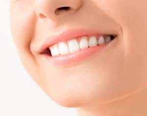 Close up of woman's mouth that is grinning