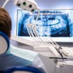 Dentist patient looking at a dental x-ray image
