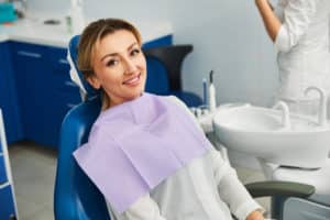 Woman in a dental office having a seat in a medical chair