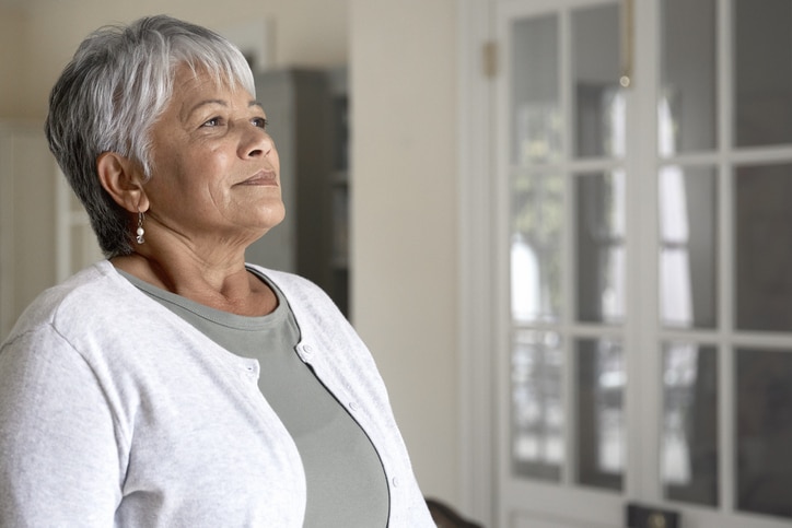Senior woman taking a deep breath